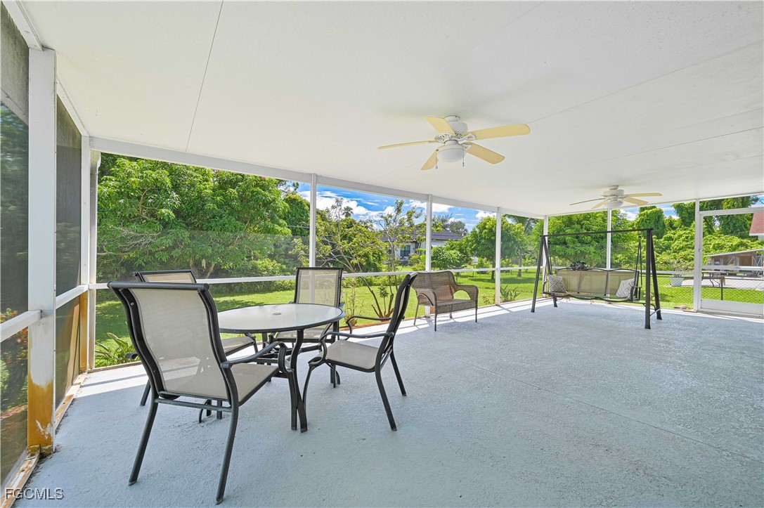 18217 Sycamore Road Fort Myers, FL 33967 - Photo 31 of 35 a view of a city from a dining room with large windows