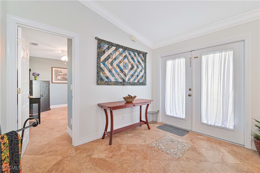 18217 Sycamore Road Fort Myers, FL 33967 - Photo 4 of 35 an empty room with windows and bench