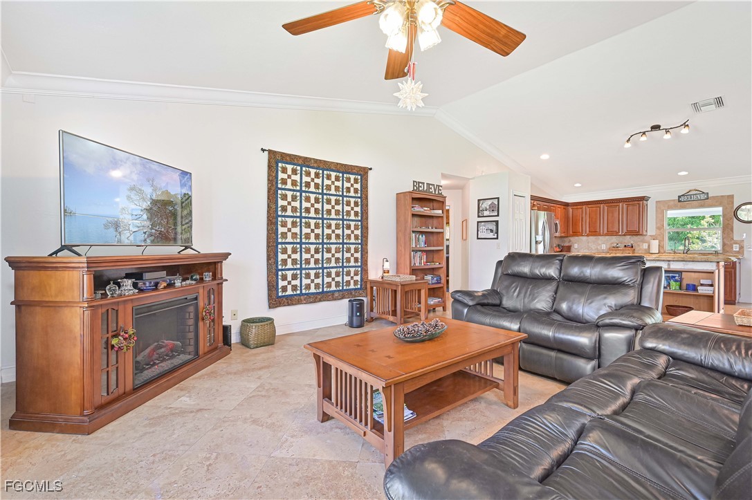 18217 Sycamore Road Fort Myers, FL 33967 - Photo 6 of 35 a living room with furniture and a flat screen tv