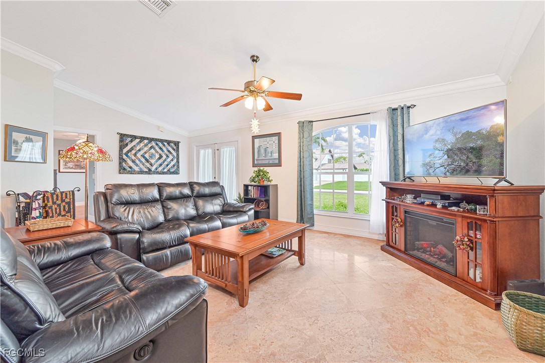 18217 Sycamore Road Fort Myers, FL 33967 - Photo 8 of 35 a living room with furniture and a flat screen tv