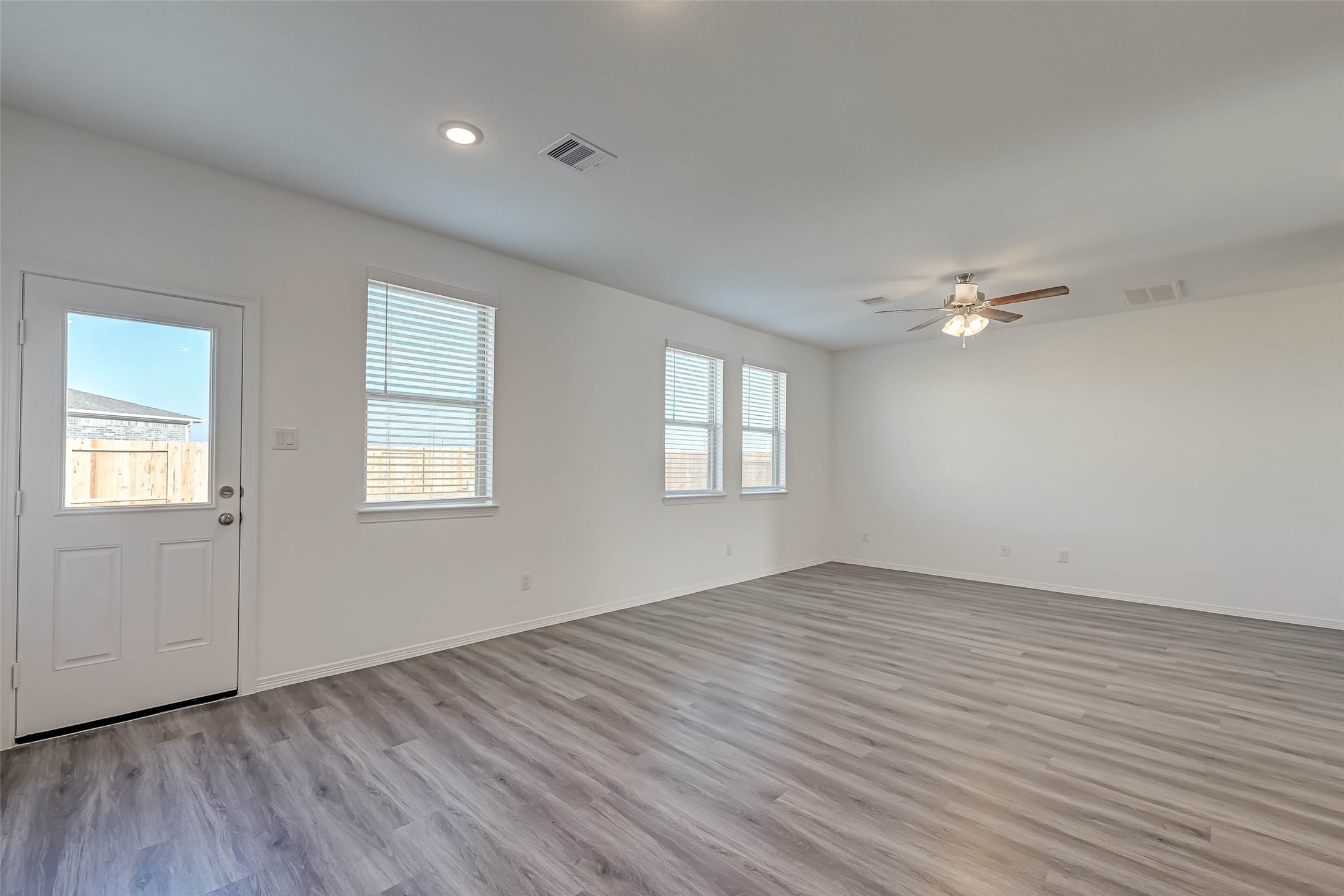 23226 Morning Splendor Drive Katy, TX 77493 - Photo 5 of 22 a view of an empty room with wooden floor and a window