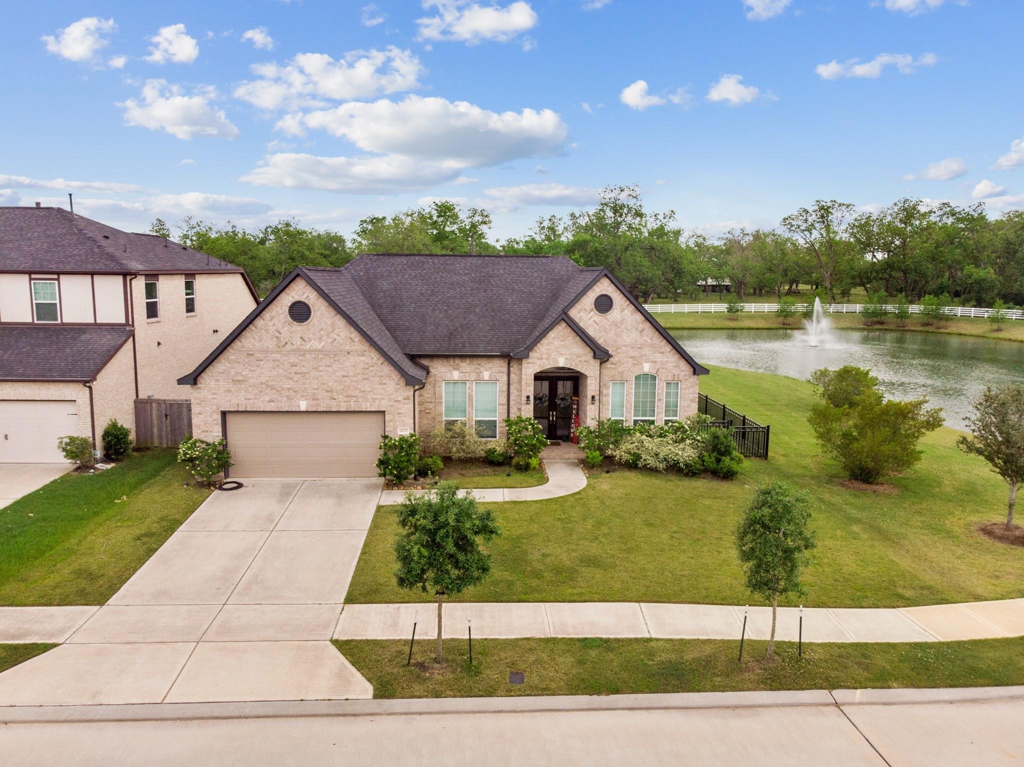 4227 Carol Ridge Drive Sugar Land, TX 77479 - Photo 1 of 35 a front view of a house with a yard