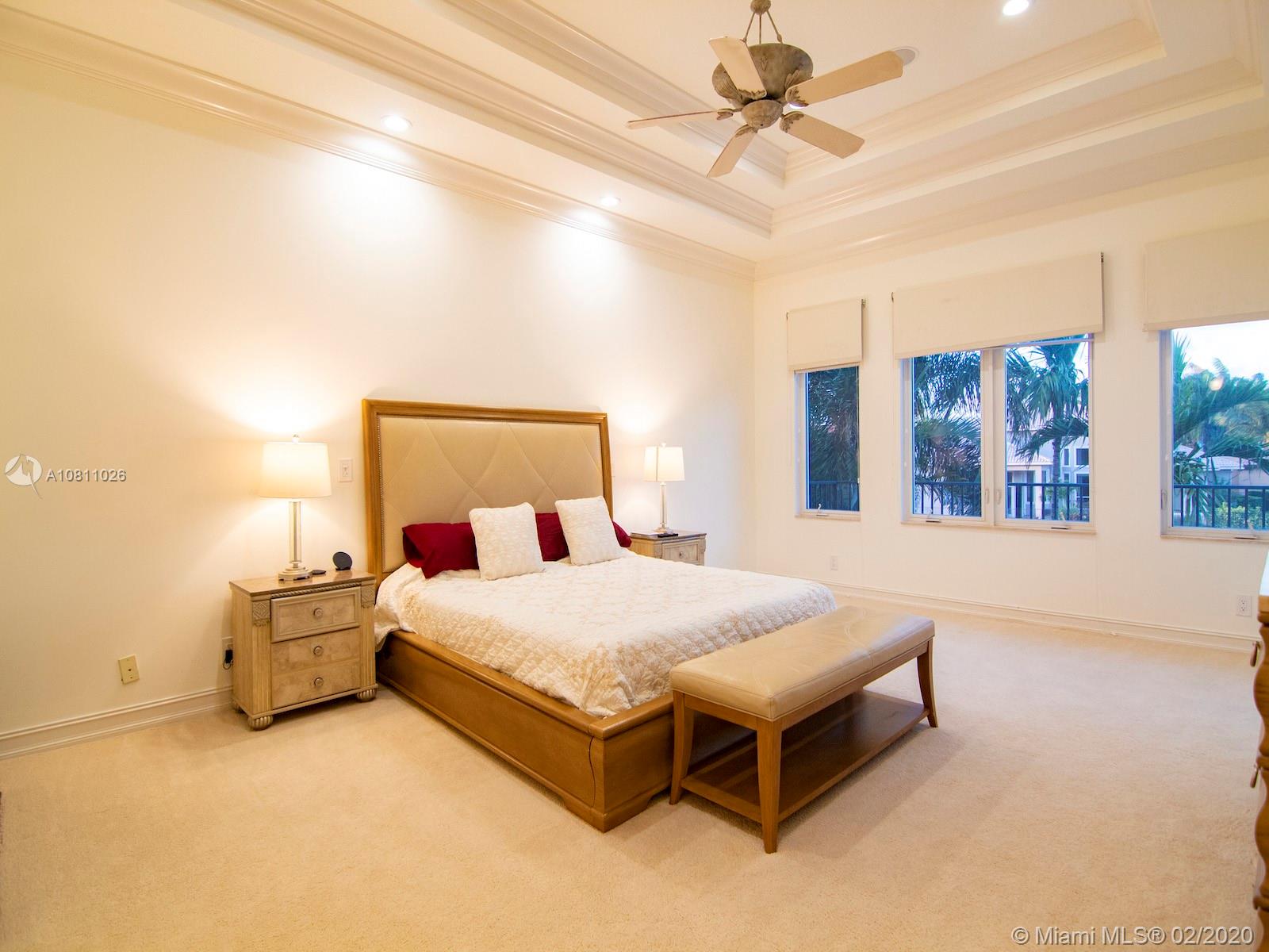9597 Bridgebrook Drive Boca Raton, FL 33496 - Photo 16 of 37 a bedroom with a bed and window