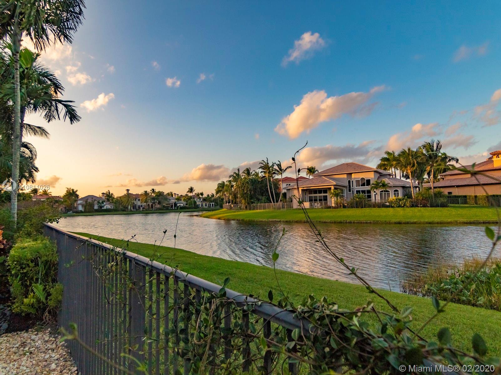 9597 Bridgebrook Drive Boca Raton, FL 33496 - Photo 20 of 37 an aerial view of a house with outdoor space and lake view in back