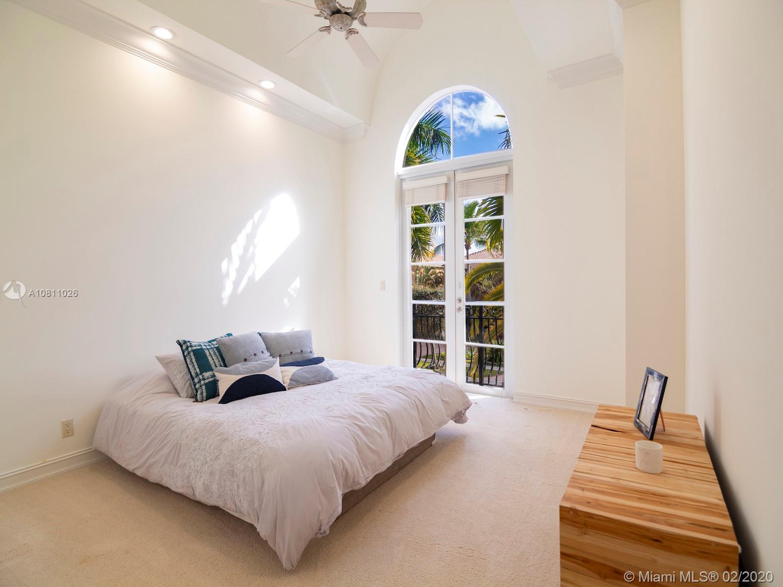 9597 Bridgebrook Drive Boca Raton, FL 33496 - Photo 29 of 37 a bedroom with a bed and a window