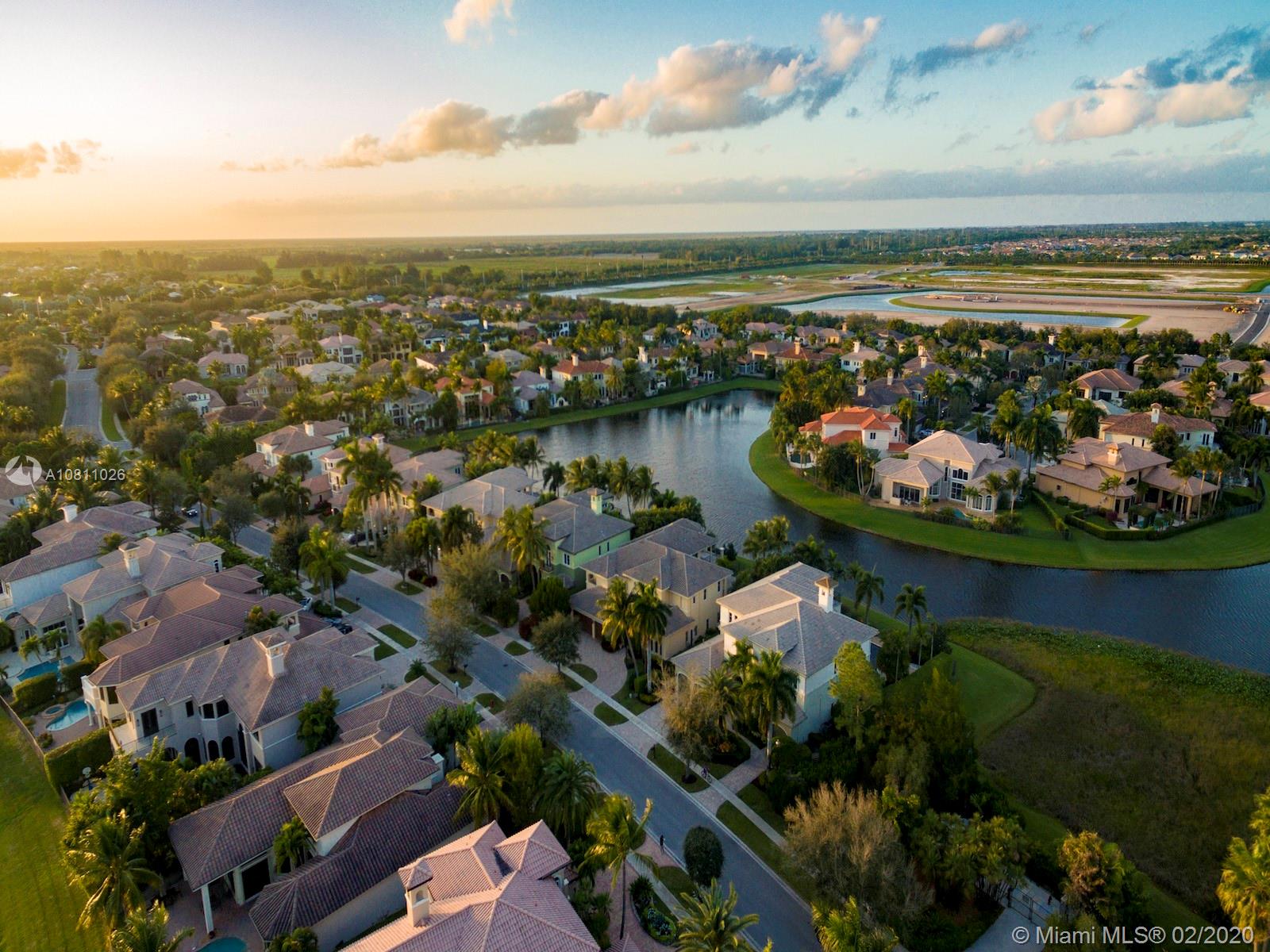 9597 Bridgebrook Drive Boca Raton, FL 33496 - Photo 33 of 37 an aerial view of a city