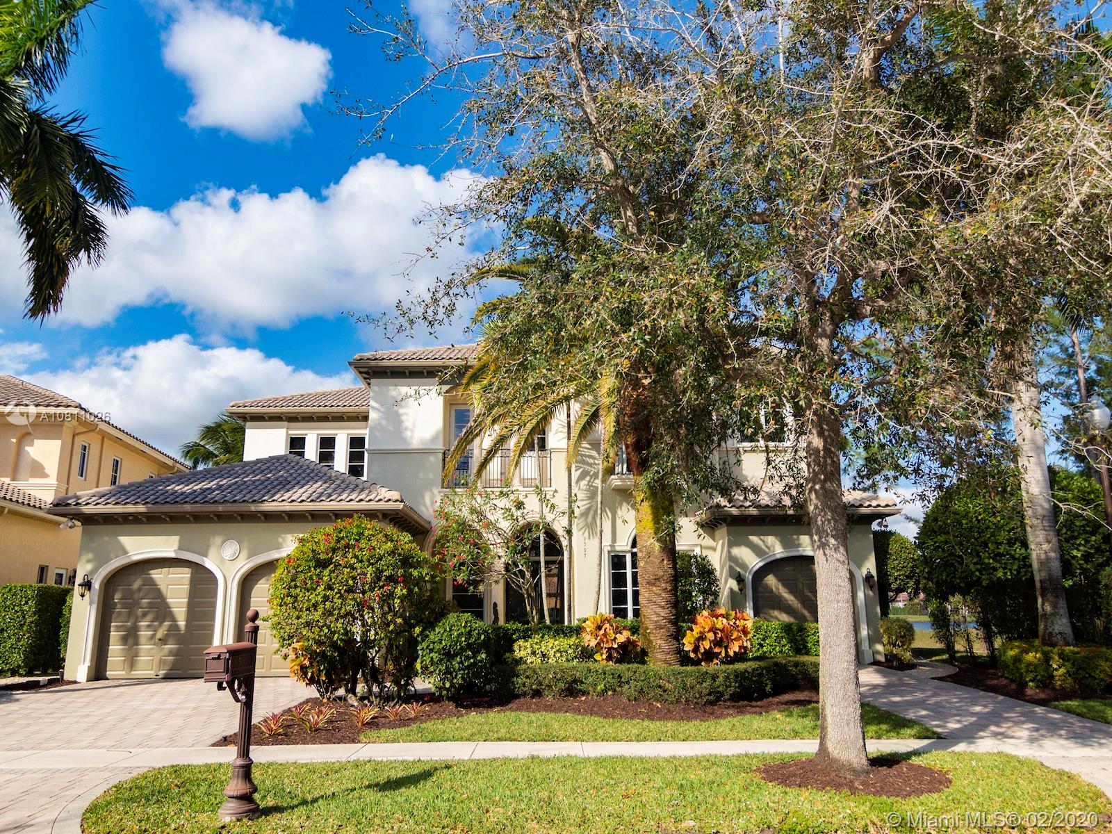 9597 Bridgebrook Drive Boca Raton, FL 33496 - Photo 34 of 37 a front view of a building with garden