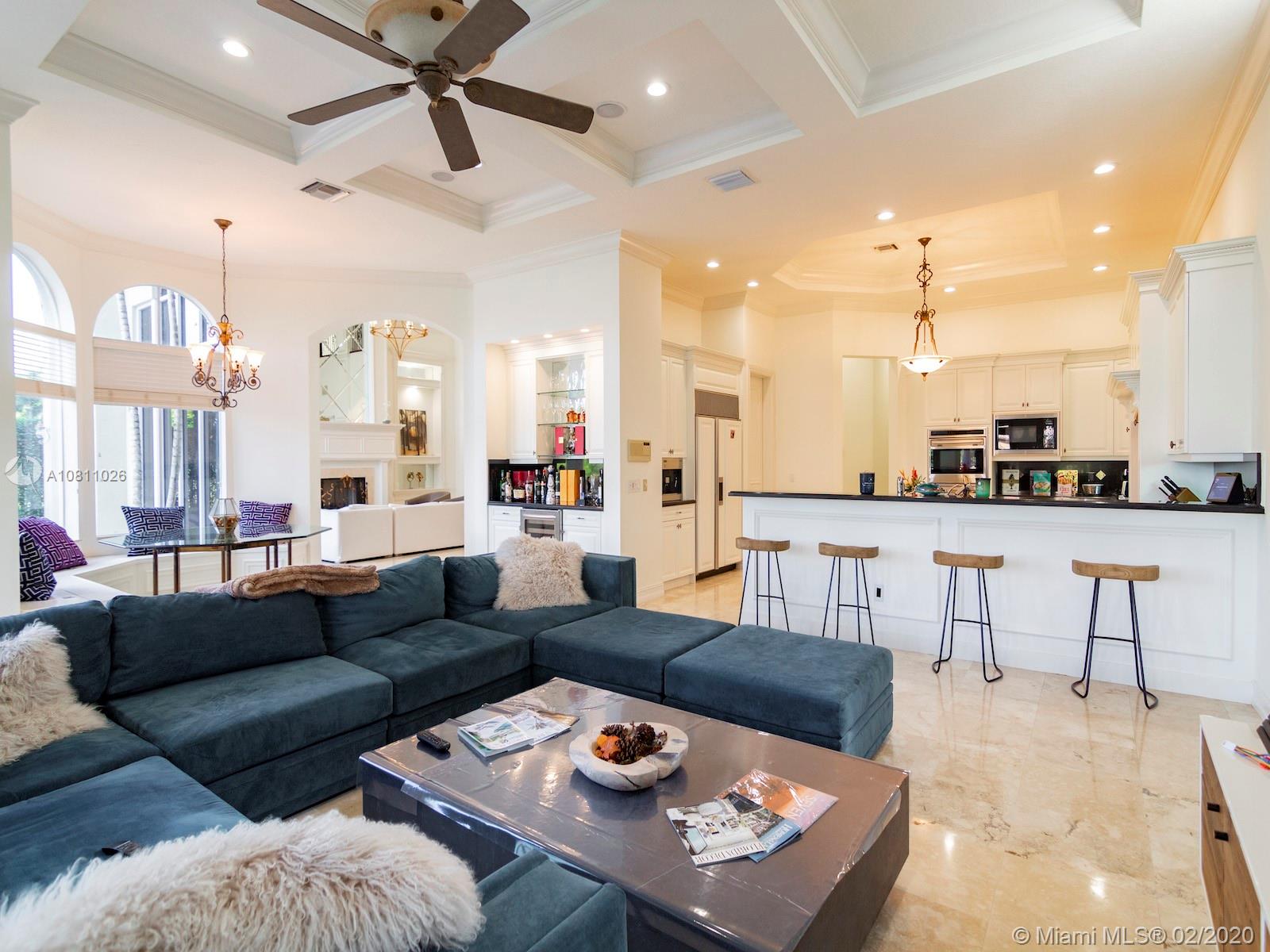 9597 Bridgebrook Drive Boca Raton, FL 33496 - Photo 4 of 37 a living room with furniture and a view of kitchen