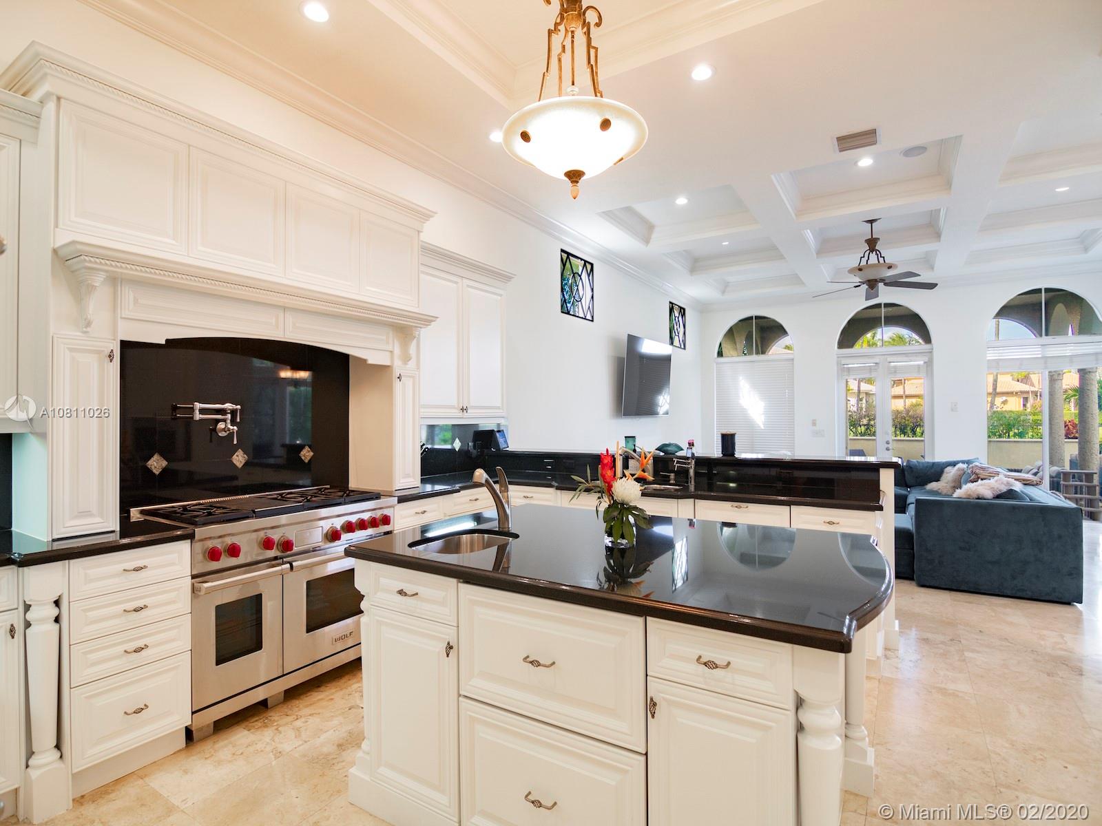 9597 Bridgebrook Drive Boca Raton, FL 33496 - Photo 6 of 37 a kitchen with sink stove and cabinets