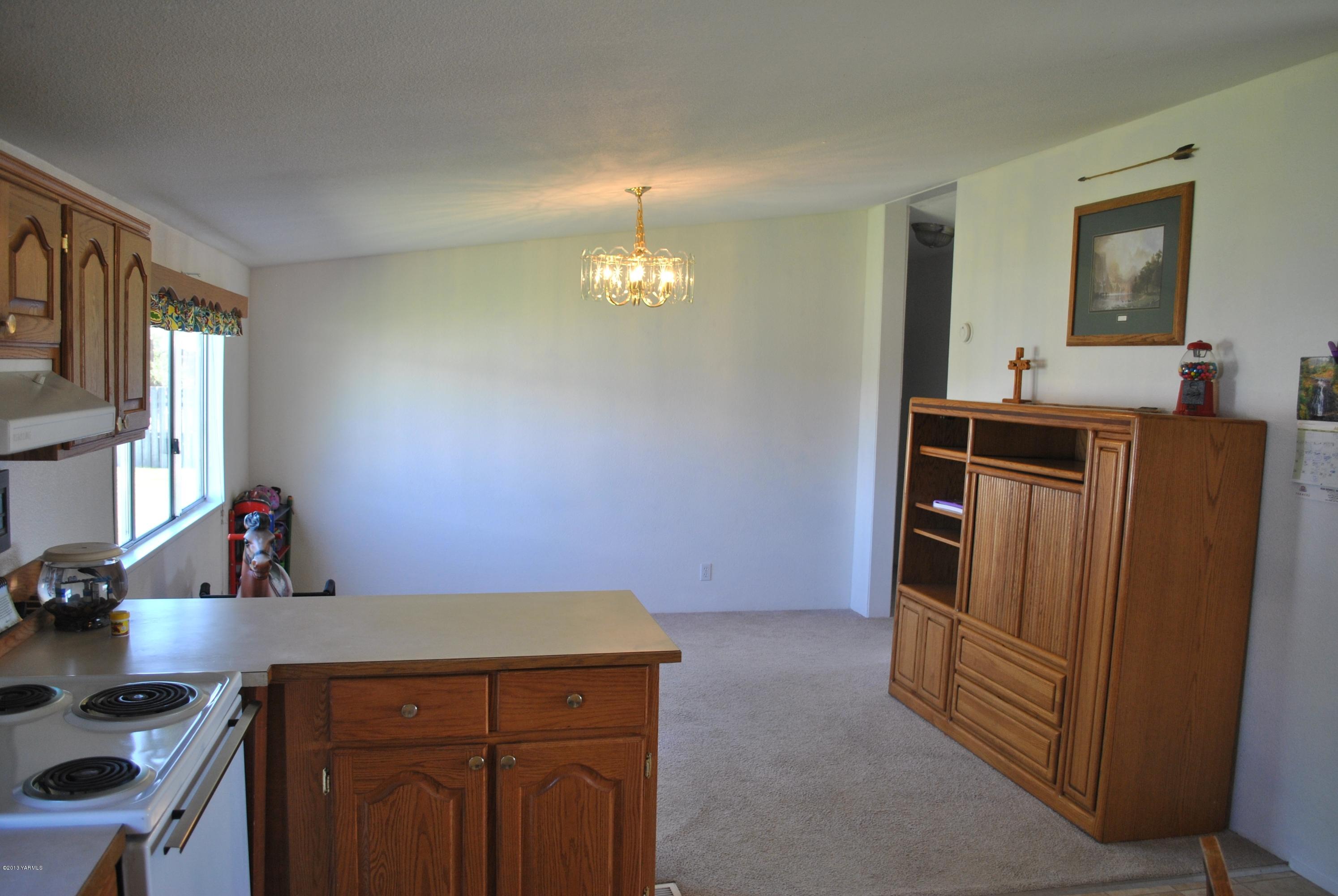 1231 Holaday Road Mabton, WA 98935 - Photo 3 of 29 a kitchen with cabinets and window