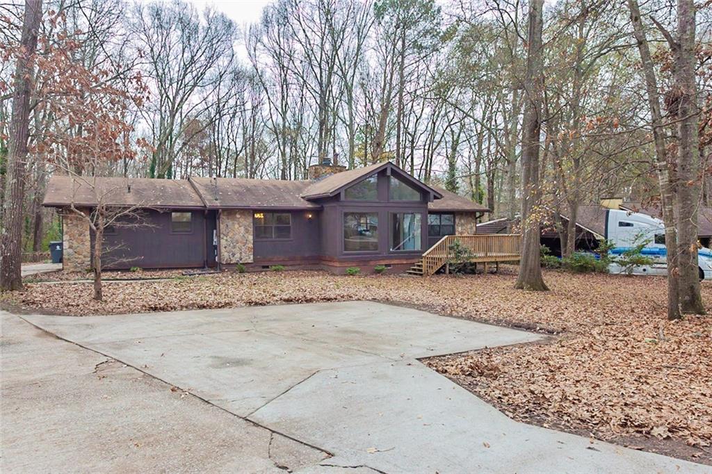 430 Davis Road Stockbridge, GA 30281 - Photo 1 of 1 a front view of a house with a yard and garage