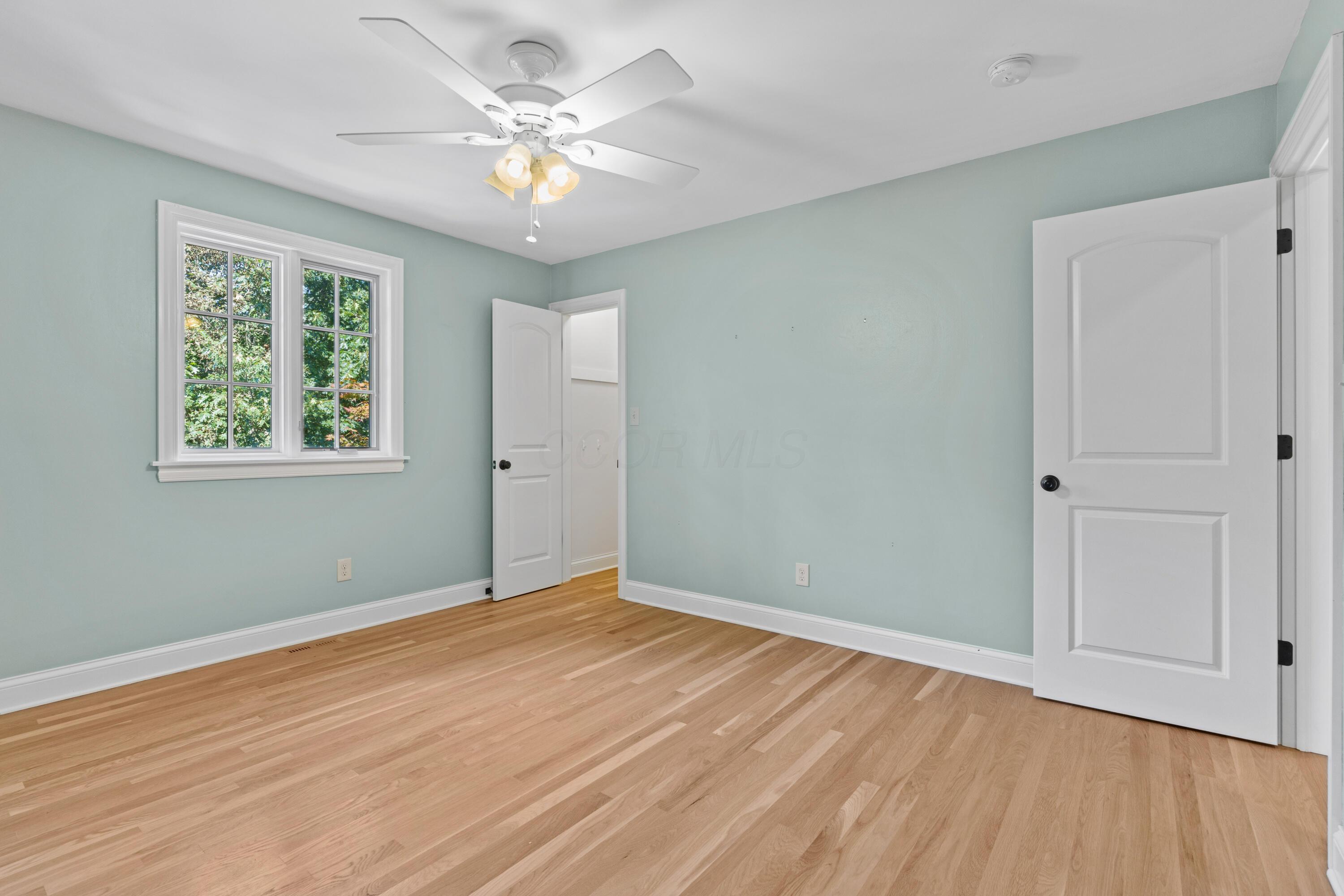 1326 Windham Road Columbus, OH 43220 - Photo 38 of 67 Hardwood floors with large closet and ceiling fan