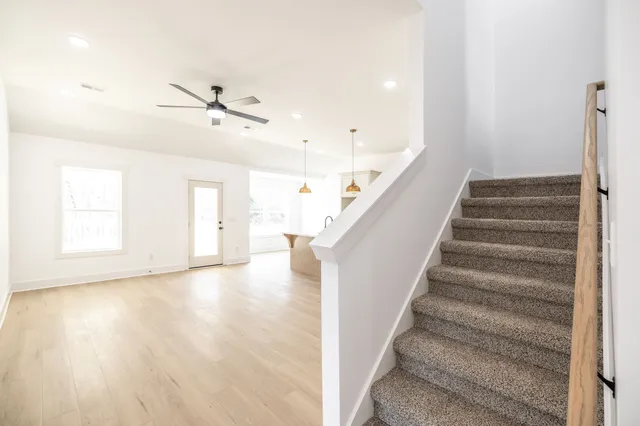 a view of an entryway with wooden floor