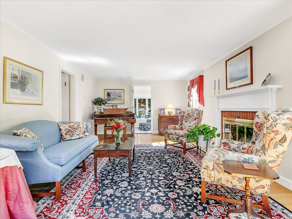 108 Meadowbrook Road Needham, MA 02492 - Photo 21 of 38 a living room with furniture and a fireplace