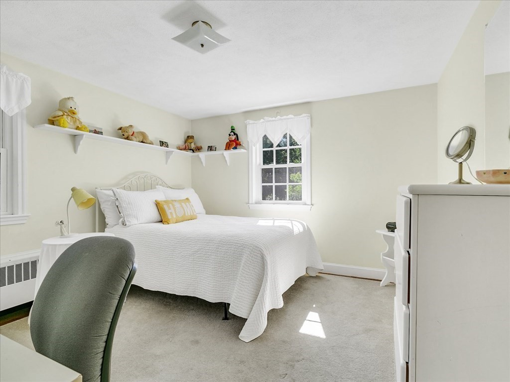 108 Meadowbrook Road Needham, MA 02492 - Photo 29 of 38 a bed room with a bed and a chair