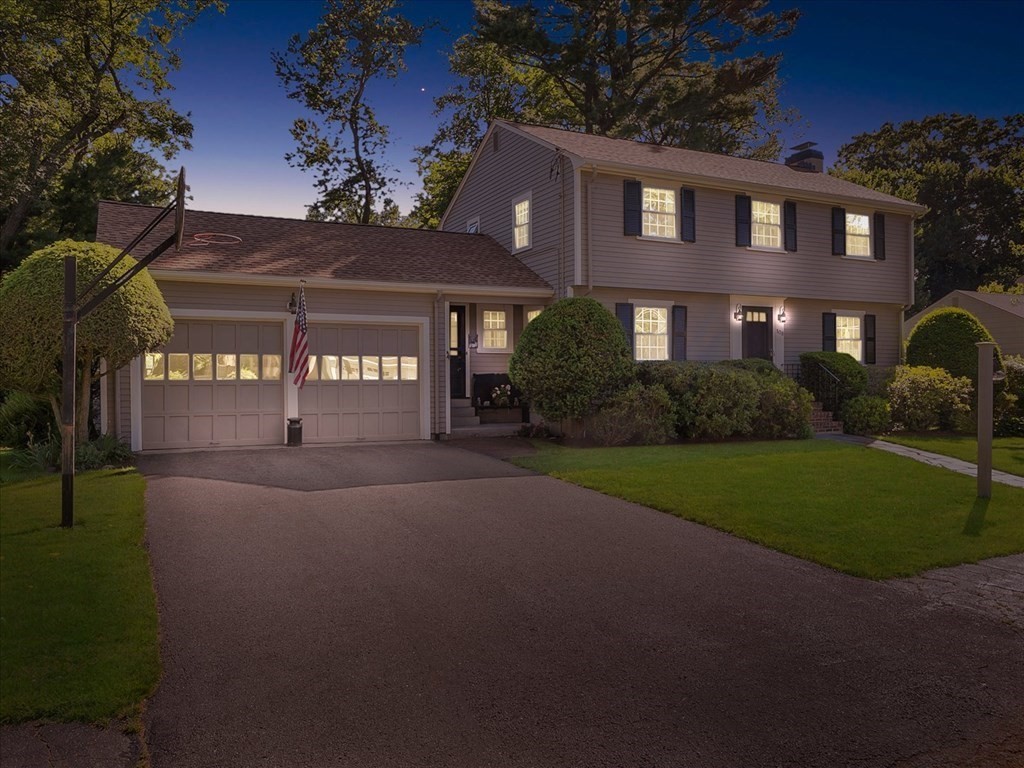 108 Meadowbrook Road Needham, MA 02492 - Photo 3 of 38 a front view of a house with a yard and garage