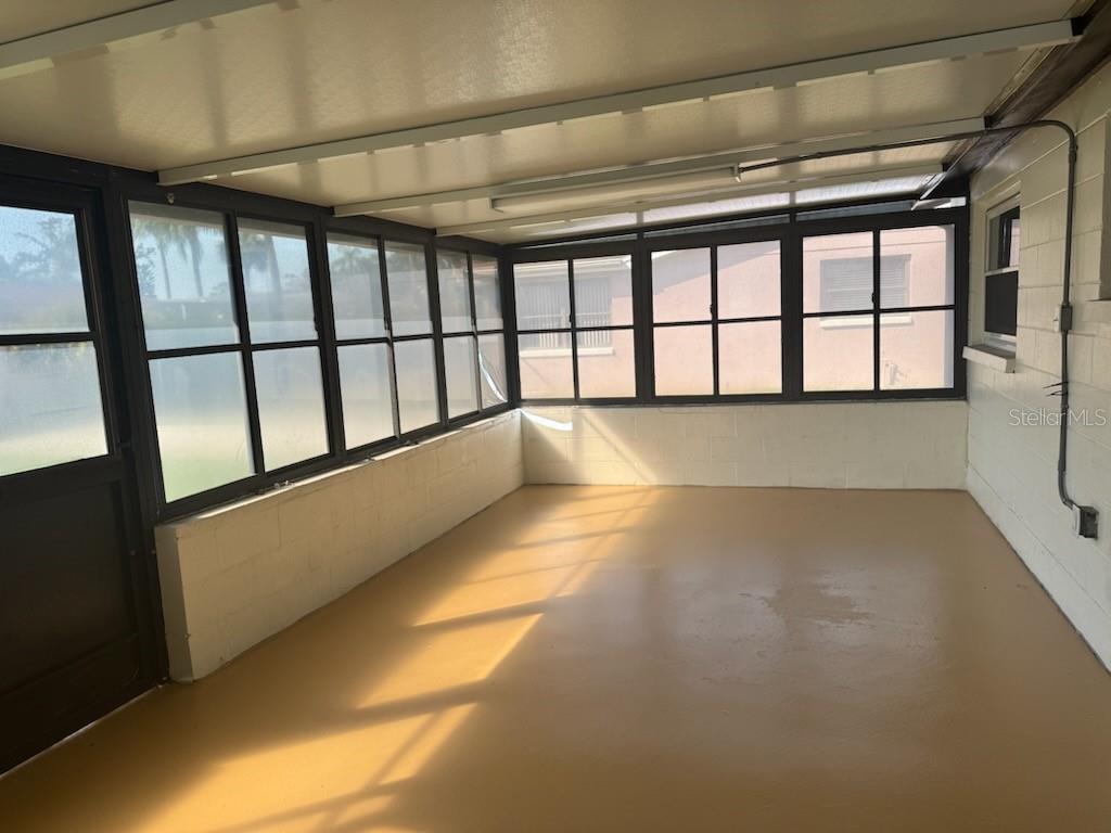 9617 Lake Chrise Lane Port Richey, FL 34668 - Photo 4 of 6 a view of an empty room with a window