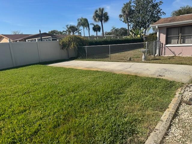 9617 Lake Chrise Lane Port Richey, FL 34668 - Photo 5 of 6 a view of backyard with large tree