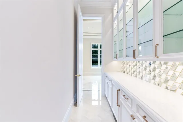 a bathroom with a bathtub sink and mirror