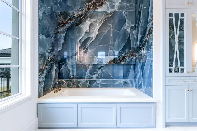 a bathroom with a bathtub and shower