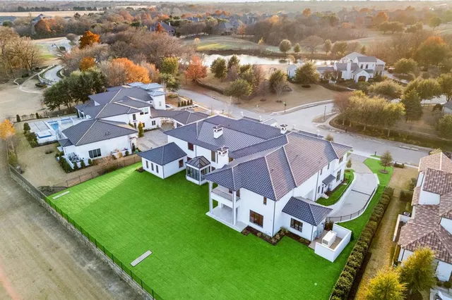 an aerial view of a house with a garden