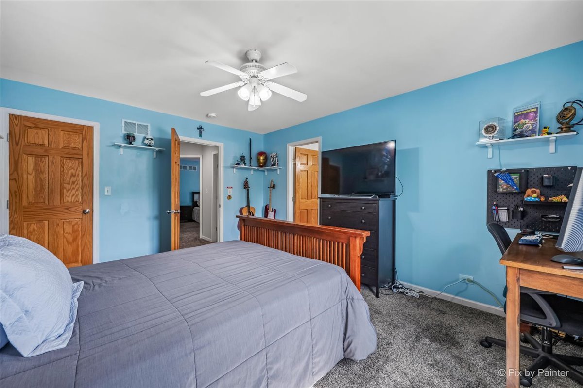 7104 Dove Way Cary, IL 60013 - Photo 37 of 82 a bedroom with a bed and a flat screen tv