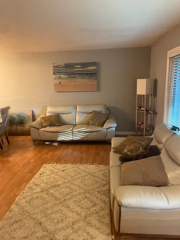 a living room with furniture and a ocean view
