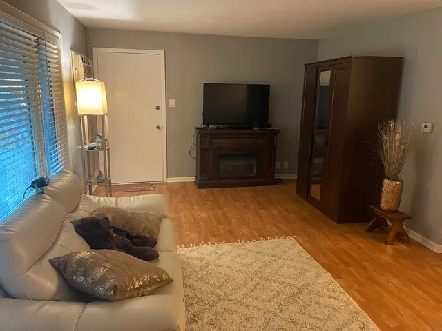 a living room with a couch and a flat screen tv
