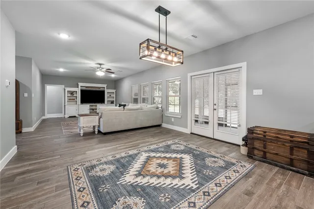 a living room with furniture and kitchen view