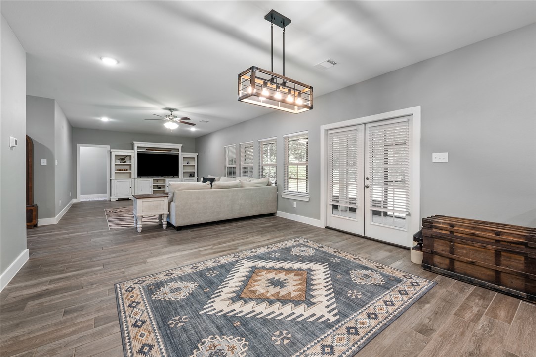 8729 Nathan Drive Waller, TX 77484 - Photo 19 of 48 Living room with ceiling fan and wood finished floors