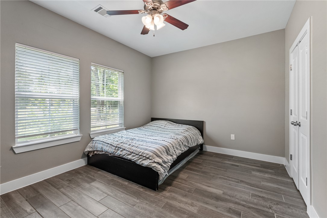 8729 Nathan Drive Waller, TX 77484 - Photo 24 of 48 Bedroom with wood finished floors and ceiling fan