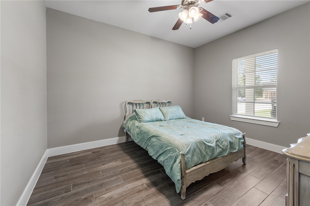 8729 Nathan Drive Waller, TX 77484 - Photo 26 of 48 Bedroom with wood finished floors and a ceiling fan
