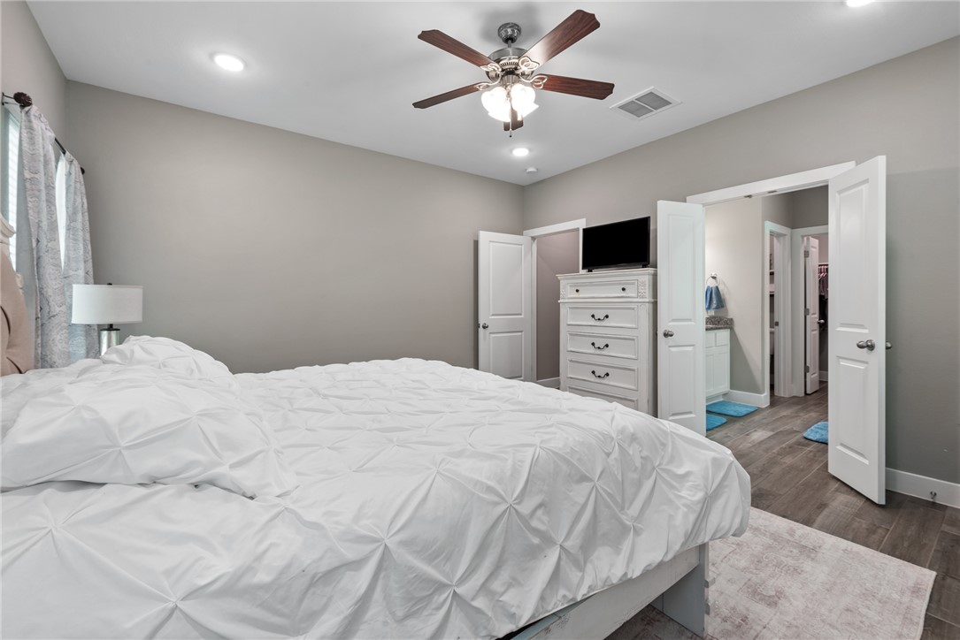 8729 Nathan Drive Waller, TX 77484 - Photo 29 of 48 Bedroom featuring dark wood-style flooring, recessed lighting, and ceiling fan