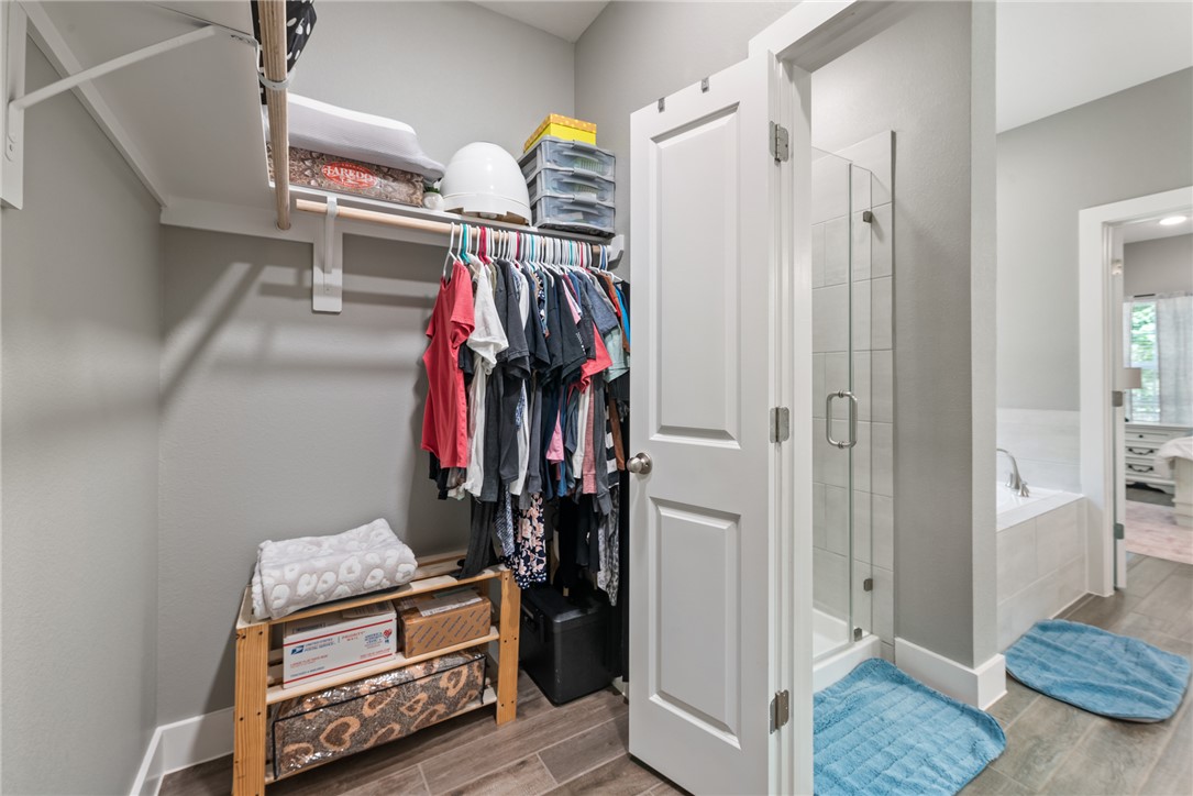 8729 Nathan Drive Waller, TX 77484 - Photo 35 of 48 Walk in closet with wood finished floors