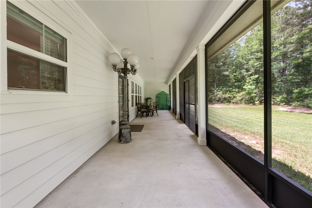 8729 Nathan Drive Waller, TX 77484 - Photo 38 of 48 Unfurnished sunroom featuring a chandelier