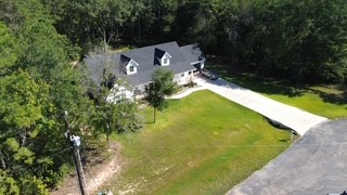 8729 Nathan Drive Waller, TX 77484 - Photo 43 of 48 Aerial view of property and surrounding area featuring a forest