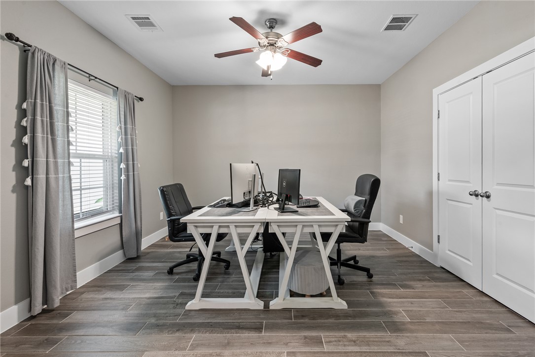 8729 Nathan Drive Waller, TX 77484 - Photo 7 of 48 Office featuring ceiling fan, plenty of natural light, and dark wood-style floors