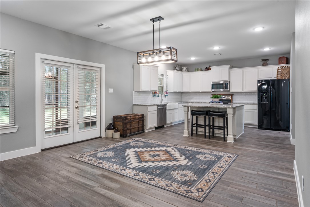 8729 Nathan Drive Waller, TX 77484 - Photo 8 of 48 Kitchen featuring appliances with stainless steel finishes, backsplash, plenty of natural light, and recessed lighting