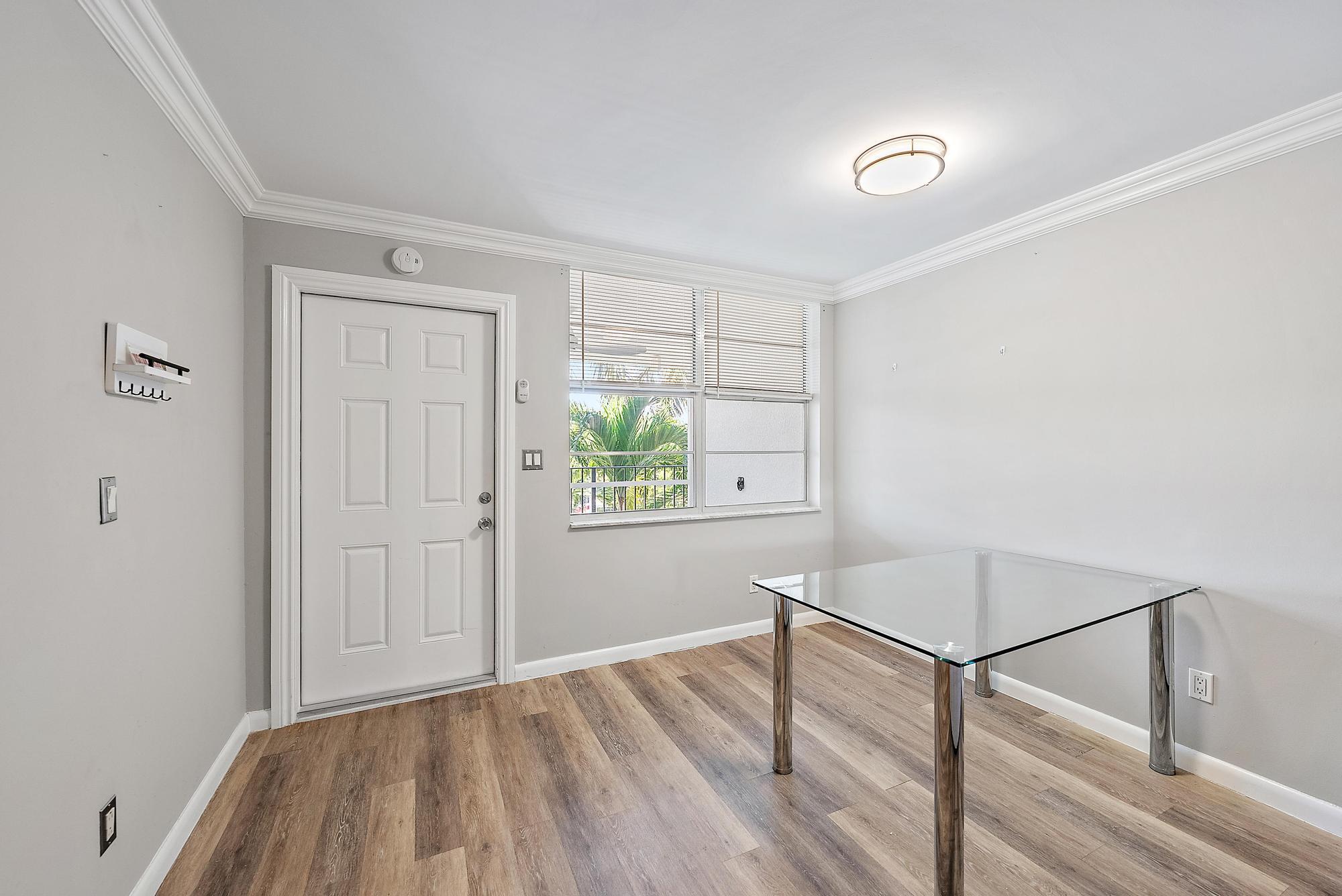109 Paradise Harbour Boulevard, Unit 307 North Palm Beach, FL 33408 - Photo 10 of 20 Dining room leading to front door
