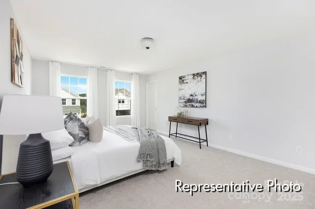 a bedroom with a bed and a chair