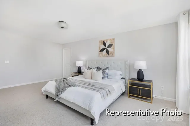 a bedroom with a bed and a night stand