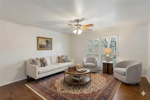 a living room with furniture and a rug