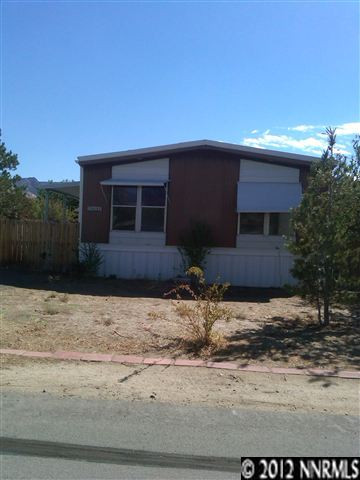 15055 Rhyolite Circle Reno, NV 89521 - Photo 1 of 1 a front view of a house with a yard