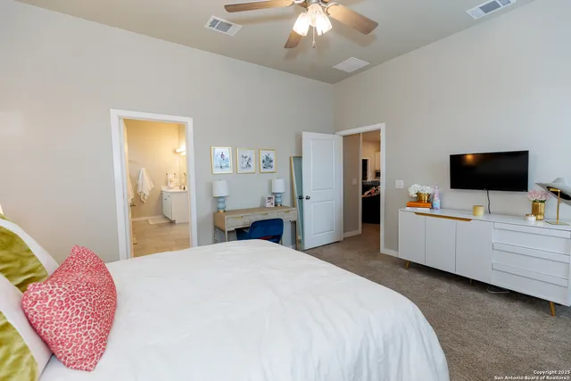 a bedroom with a bed and a dresser