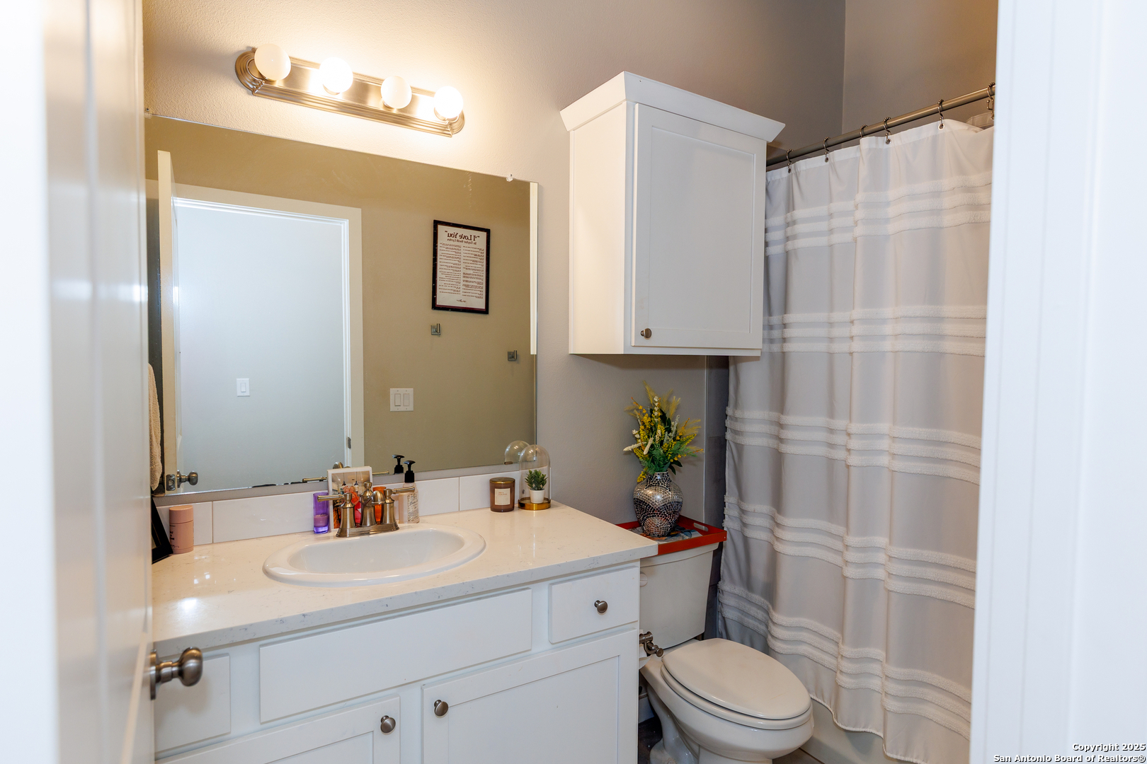 7419 29th Street Lubbock, TX 79407 - Photo 17 of 21 a bathroom with a sink a toilet and shower