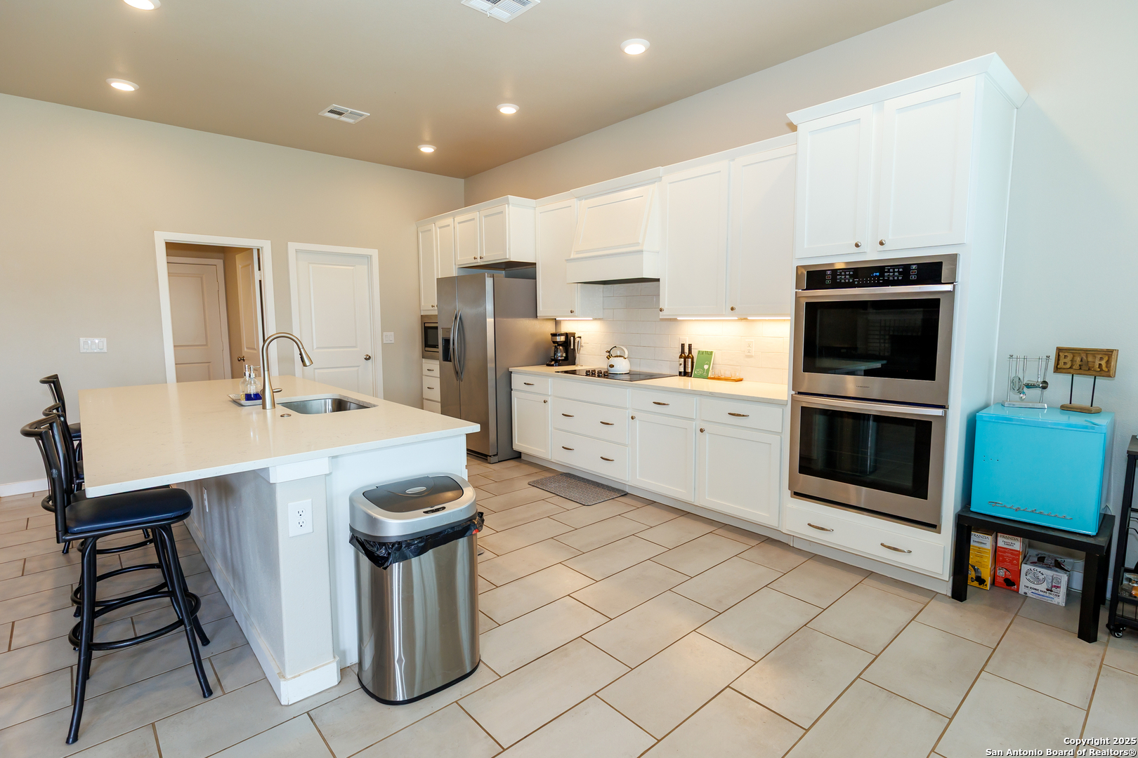 7419 29th Street Lubbock, TX 79407 - Photo 4 of 21 a kitchen with stainless steel appliances kitchen island granite countertop a sink and cabinets
