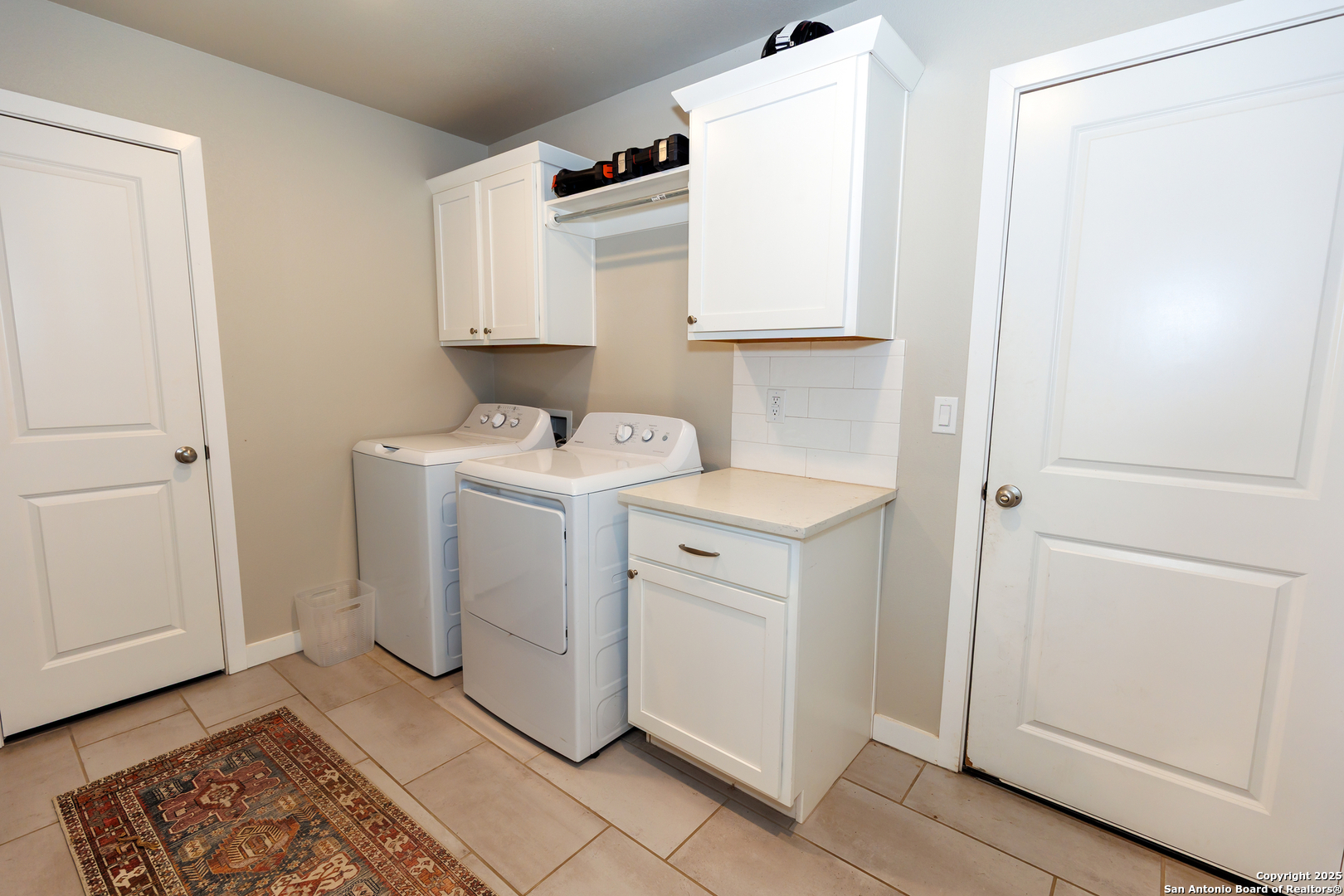 7419 29th Street Lubbock, TX 79407 - Photo 6 of 21 a utility room with dryer and washer