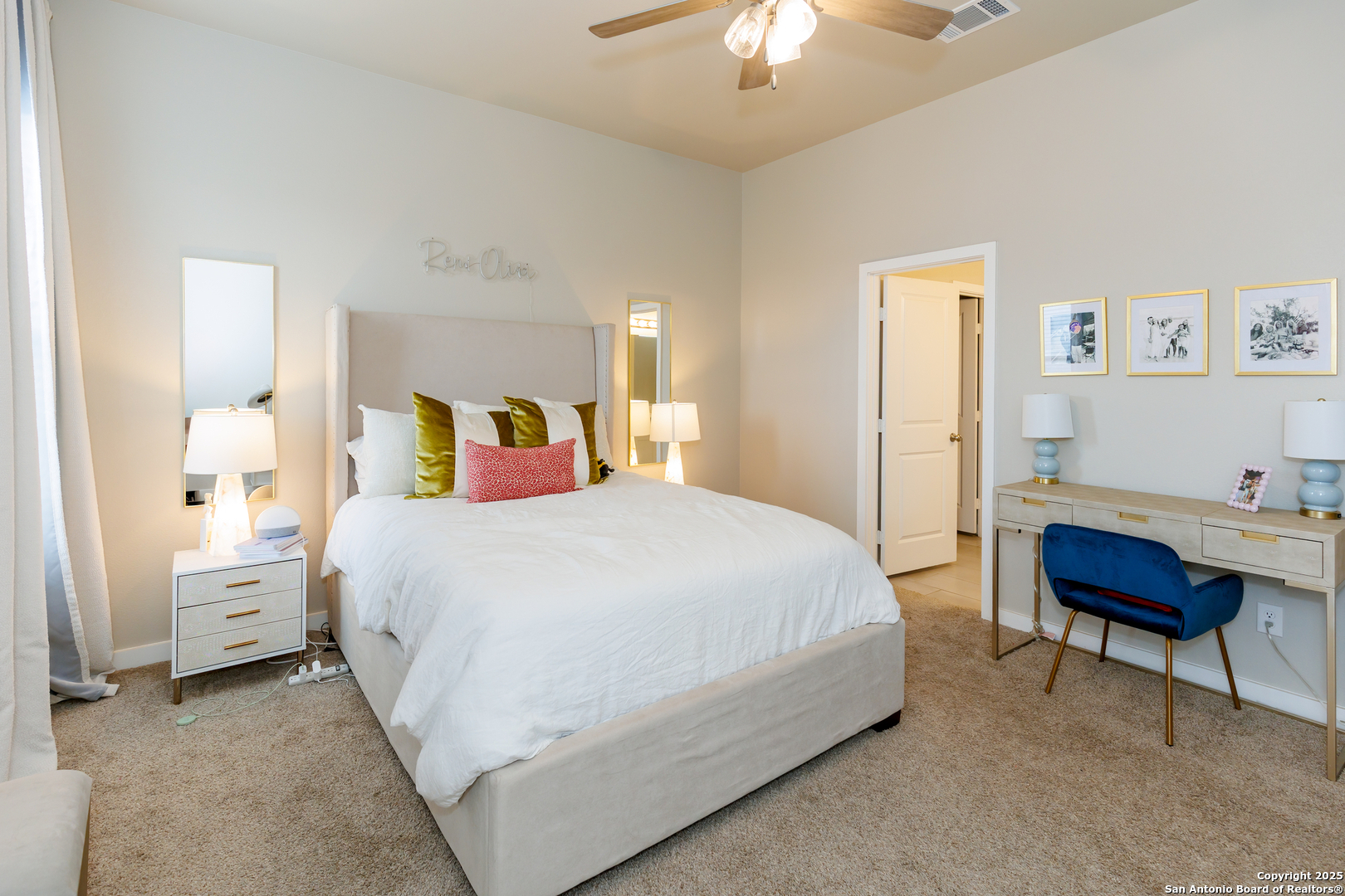 7419 29th Street Lubbock, TX 79407 - Photo 8 of 21 a bedroom with a bed and a chandelier
