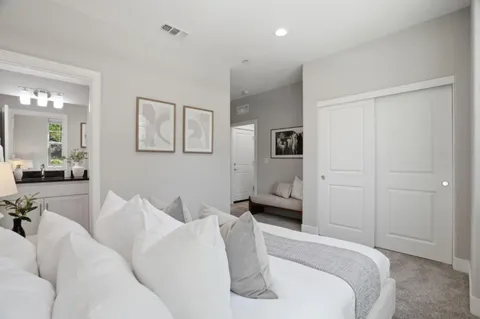 a bed room with a bed and furniture