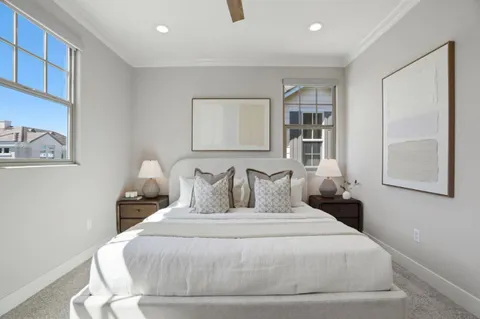 a large white bed in a white room